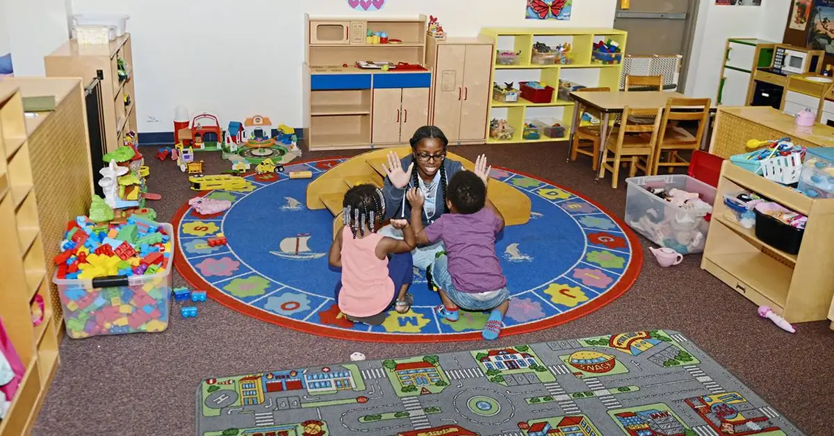 A Jeremiah's Place worker entertains two children at the East Liberty facility