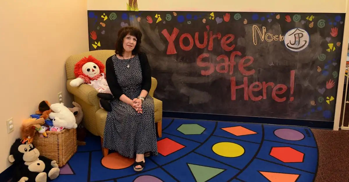 Former Jeremiah's Place Executive Director, LouAnn Ross, poses for a photo