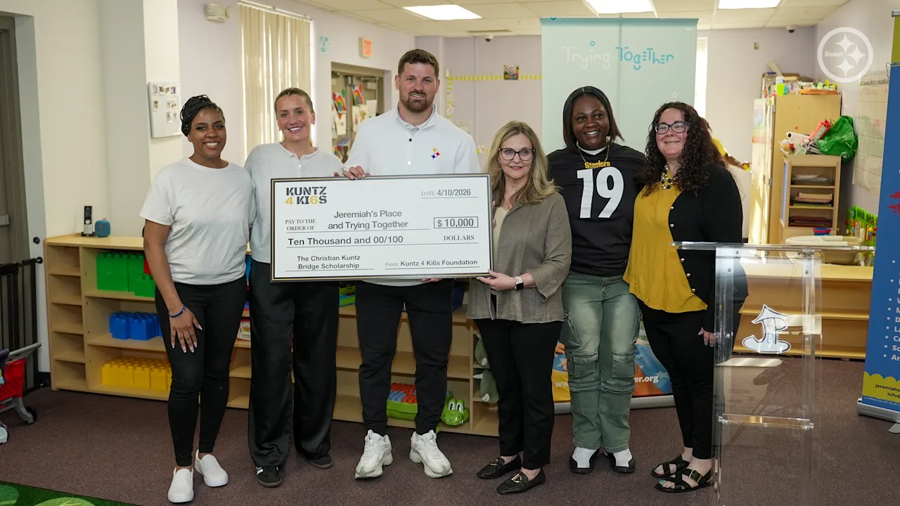 Christian Kuntz presenting a check to Jeremiah's Place for the Kuntz 4 Ki6s Foundation